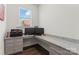 Bright office featuring a granite countertop desk with stylish gray drawers at 12018 Grey Partridge Dr, Charlotte, NC 28278