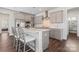 Modern kitchen with stainless steel appliances, quartz countertops, and a stylish gray color palette at 12018 Grey Partridge Dr, Charlotte, NC 28278