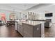 Open concept kitchen with an island, seamlessly connected to the dining and living areas at 12018 Grey Partridge Dr, Charlotte, NC 28278