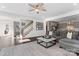 Spacious living room with dark hardwood floors, access to stairs and kitchen at 12018 Grey Partridge Dr, Charlotte, NC 28278