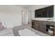 Bright living room with gray carpet, large TV and accent furniture at 12018 Grey Partridge Dr, Charlotte, NC 28278