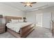 Spacious main bedroom with tray ceiling, ceiling fan and connecting room at 12018 Grey Partridge Dr, Charlotte, NC 28278