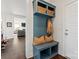 Mudroom area featuring a blue built-in bench with storage and hooks for coats at 12018 Grey Partridge Dr, Charlotte, NC 28278