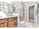 Bright bathroom showcasing a walk-in glass shower and a stylish single sink vanity at 1244 Madison Towns Ln, Charlotte, NC 28209