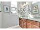 Bright bathroom featuring granite countertop and dual sinks and a well-lit mirror at 1244 Madison Towns Ln, Charlotte, NC 28209