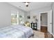 Cozy bedroom with natural light, ceiling fan, and stylish decor at 1244 Madison Towns Ln, Charlotte, NC 28209