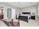 Spacious bedroom with neutral walls, ceiling fan, and access to an ensuite bathroom at 1244 Madison Towns Ln, Charlotte, NC 28209