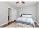 Bright bedroom with plush carpeting, ceiling fan, and ensuite bathroom at 1244 Madison Towns Ln, Charlotte, NC 28209