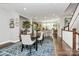 Open dining space flowing into kitchen, featuring hardwood floors and natural light at 1244 Madison Towns Ln, Charlotte, NC 28209