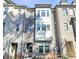 Elegant townhome with brick facade, multiple windows, and neat landscaping at 1244 Madison Towns Ln, Charlotte, NC 28209