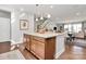 Bright kitchen with a large central island, granite countertops, and stainless steel appliances at 1244 Madison Towns Ln, Charlotte, NC 28209