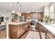 Spacious kitchen features a large island, stainless steel appliances, and wood cabinets at 1244 Madison Towns Ln, Charlotte, NC 28209