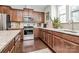 Updated kitchen featuring stainless steel appliances, stone countertops, and ample cabinet space at 1244 Madison Towns Ln, Charlotte, NC 28209