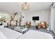 Open living area with modern decor, a flat-screen TV, and access to the dining space at 1244 Madison Towns Ln, Charlotte, NC 28209