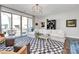 Bright living room featuring a large sectional sofa, stylish rug, and balcony access at 1244 Madison Towns Ln, Charlotte, NC 28209