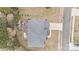 From above: a home with an expansive backyard deck, lush greenery, and driveway with parking at 13132 Purple Dawn Dr, Charlotte, NC 28213