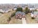 An aerial view showcases the beautiful brick home, surrounded by lush landscaping and mature trees in a quiet neighborhood at 13132 Purple Dawn Dr, Charlotte, NC 28213