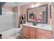 This bathroom offers a double vanity, a large mirror, and a shower with glass door at 13132 Purple Dawn Dr, Charlotte, NC 28213