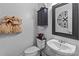 Charming half-bathroom with modern fixtures, decorative mirror and towel arrangement at 13132 Purple Dawn Dr, Charlotte, NC 28213