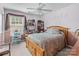 Cozy bedroom has a ceiling fan, natural light, and offers a comfortable and inviting personal space at 13132 Purple Dawn Dr, Charlotte, NC 28213