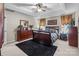 A well-appointed main bedroom features a ceiling fan, natural light, and offers relaxation at 13132 Purple Dawn Dr, Charlotte, NC 28213
