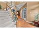 Elegant foyer with hardwood floors, a staircase with white railing, and views into other living spaces at 13132 Purple Dawn Dr, Charlotte, NC 28213