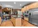 Spacious kitchen with stainless steel appliances, a center island, and a dining area at 13132 Purple Dawn Dr, Charlotte, NC 28213