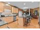Bright kitchen with a center island, stainless steel appliances, and wooden cabinets at 13132 Purple Dawn Dr, Charlotte, NC 28213