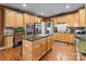 Open kitchen featuring granite countertops, wooden cabinets, and stainless steel appliances at 13132 Purple Dawn Dr, Charlotte, NC 28213