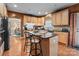 Modern kitchen with granite countertops, maple cabinets, an island with bar seating, and hardwood floors at 13132 Purple Dawn Dr, Charlotte, NC 28213