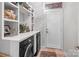 The laundry room features modern machines, ample storage and shelving, and a clean functional space at 13132 Purple Dawn Dr, Charlotte, NC 28213