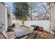 Lush backyard with a patio, table, chairs, and shade, great for outdoor enjoyment at 157 Talbert Town Loop, Mooresville, NC 28117