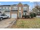 Charming brick townhome with attached garage and landscaped front yard at 157 Talbert Town Loop, Mooresville, NC 28117