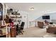 This loft features neutral walls and is furnished with comfortable seating and a desk at 157 Talbert Town Loop, Mooresville, NC 28117