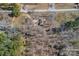 An aerial view showing the home with surrounding nature and an access road at 1874 Mcilwain Rd, Lancaster, SC 29720