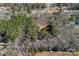 Aerial view of the home, pond, trees, and overall landscape from above at 1874 Mcilwain Rd, Lancaster, SC 29720