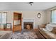 A living room featuring a fireplace, hardwood floors, an area rug and plenty of natural light at 1874 Mcilwain Rd, Lancaster, SC 29720