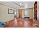 Open living room with wood floors, decorative rug, and a view into another room at 1874 Mcilwain Rd, Lancaster, SC 29720