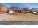 Charming single-story brick home features a well-manicured front yard and attached garage at 1910 Connemara Ct, Gastonia, NC 28054