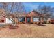 Charming brick home with manicured lawn, complemented by mature trees and an attached garage at 1910 Connemara Ct, Gastonia, NC 28054