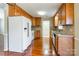 Functional kitchen features wooden cabinets, tile backsplash, and stainless-steel appliances at 1910 Connemara Ct, Gastonia, NC 28054