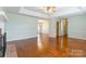 Open-concept living area with hardwood floors, natural light, and neutral paint scheme at 1910 Connemara Ct, Gastonia, NC 28054