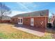 Brick home featuring a patio and well-maintained backyard; great for outdoor entertaining at 1910 Connemara Ct, Gastonia, NC 28054