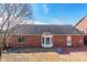 Brick home featuring a patio and well-maintained backyard; great for outdoor entertaining at 1910 Connemara Ct, Gastonia, NC 28054