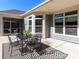 Charming back patio with an outdoor dining set, ideal for entertaining and enjoying the weather at 2209 Lincolnshire Ln, Waxhaw, NC 28173