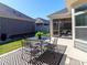 Charming back patio with an outdoor dining set, ideal for entertaining and enjoying the weather at 2209 Lincolnshire Ln, Waxhaw, NC 28173