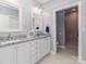 Modern bathroom featuring double vanities with granite counters, a separate toilet room and tiled shower at 2209 Lincolnshire Ln, Waxhaw, NC 28173