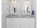 Modern bathroom featuring double vanities with granite counters, and stylish accents at 2209 Lincolnshire Ln, Waxhaw, NC 28173