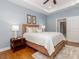 Cozy bedroom featuring tray ceilings, soft lighting, and hardwood floors at 2209 Lincolnshire Ln, Waxhaw, NC 28173