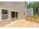 Spacious back deck with sliding glass door and stairs to backyard at 222 Ventner Ct, Charlotte, NC 28214